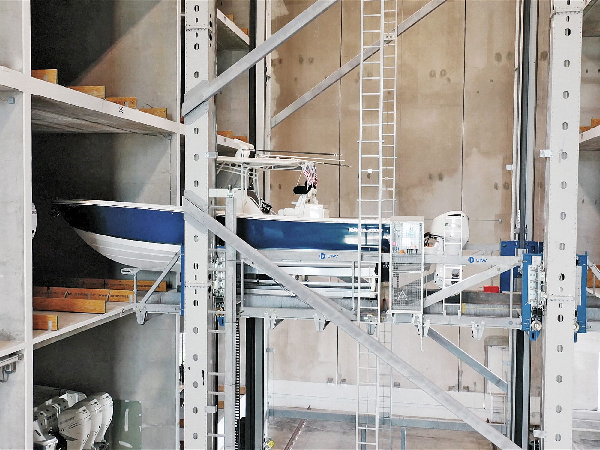 A boat rests on a ladder inside a building, showcasing an unusual indoor arrangement.